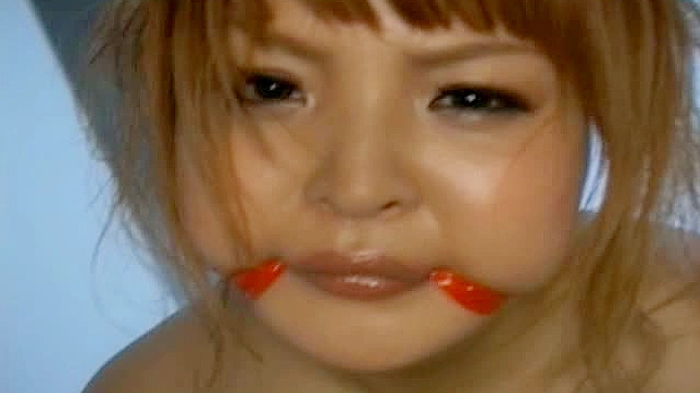 Asian Temptress Maki Shows Off Her Massive Tits Perfectly