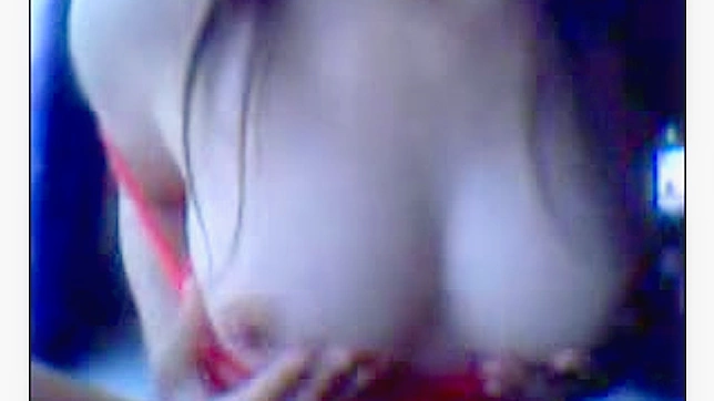 Lovely Japanese Lady Teases Her Plump Tits Seductively Online