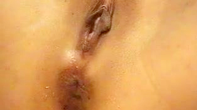 Bold Japanese Beauty Teases Her Smooth Pussy Solo