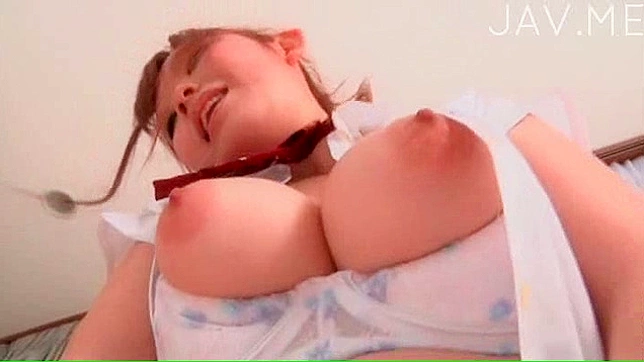 Lovely Japanese Darling Shows Off Massive Boobs Sensually