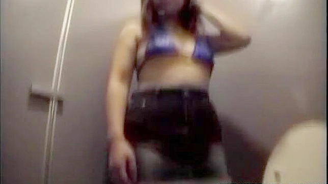 Playful Upskirt Prank Leads to Blowjob in Toilet Stall