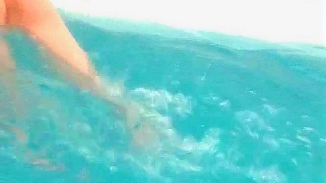 Obedient Asian Redhead Poses Seductively on Beach Sands