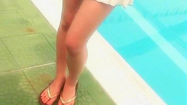 Obedient Asian Redhead Poses Seductively on Beach Sands