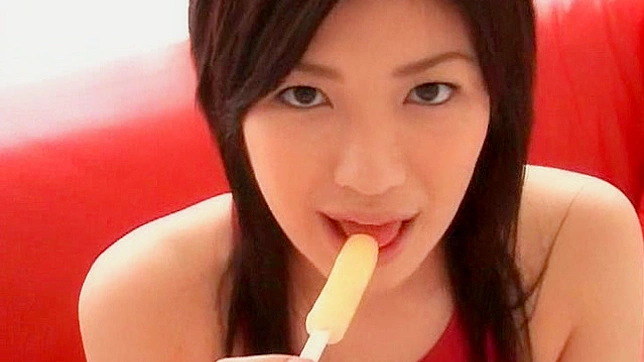 Seductive Sweetie Licks Candy with Lustful Tongue Tricks