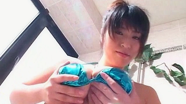 Seductive Japanese Angel Teases Her Perky Melons in Bikini