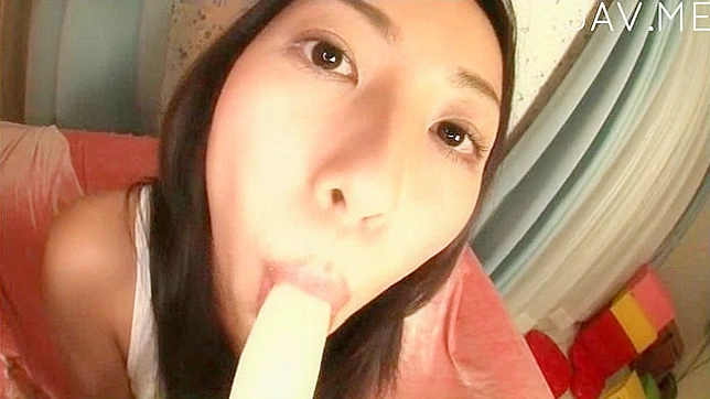 Horny Brunette Seductively Sucks a Banana
