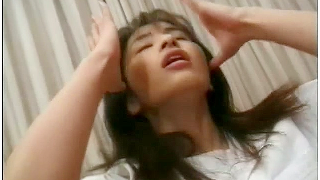 Flexible Japanese Nurse Does Hot 69 Pose on Bed