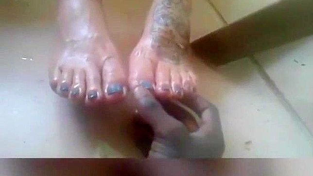 Sultry Japanese Babe Tempts With Oil-Covered Feet and Footjob