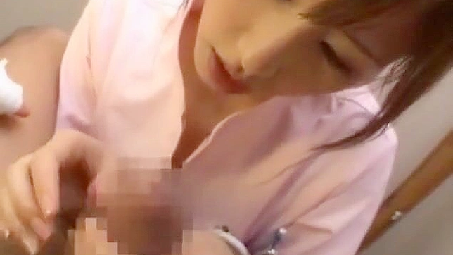 Seductive Japanese Nurse Provides Steamy Handjob Pleasure