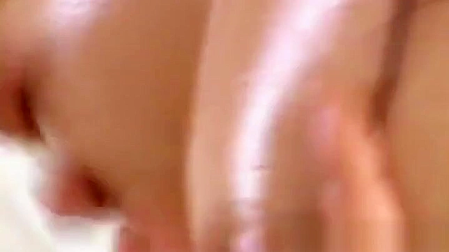 Oiled Japanese Beauty Teases With Seductive Fucking