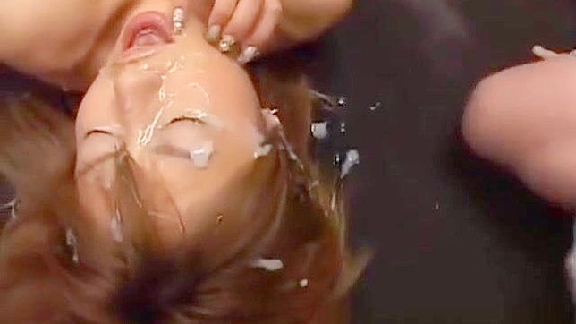 Drenched Japanese Beauty Takes Multiple Loads in Hot Bukkake Orgy