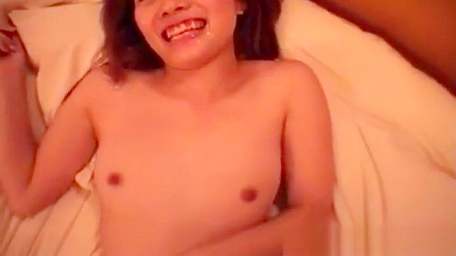 Seductive Japanese Beauty Reveals Her Lush Hairy Pussy