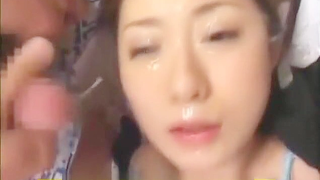 Japanese Temptation Gets Drenched In Semen During Wild Bukkake