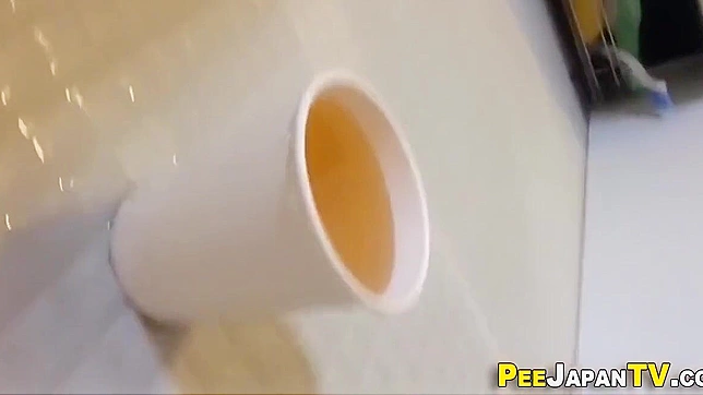 Japan's Best Pee-In-Cup Scene - Hot Wet Action Unleashed!