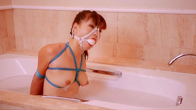 Hot Tied-Up Asian Slut Reveals Her Steamy Kinky Side Playfully