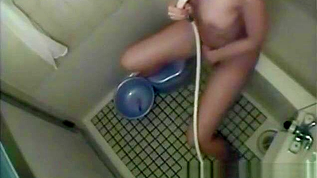 Sultry Nurse Pleasures Herself Explicitly In Dorm's Bath Stall.