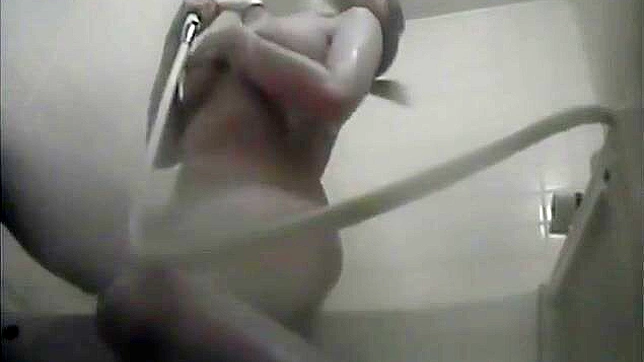 Sultry Nurse Pleasures Herself Explicitly In Dorm's Bath Stall.