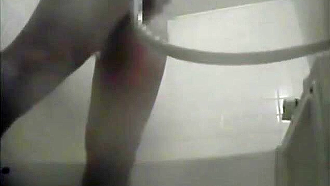 Sultry Nurse Pleasures Herself Explicitly In Dorm's Bath Stall.