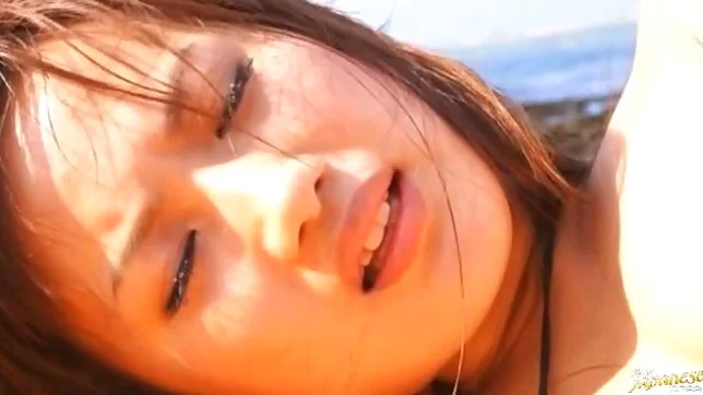 Rio Fujisaki Lovely Asian teen is fucked on the beach 3