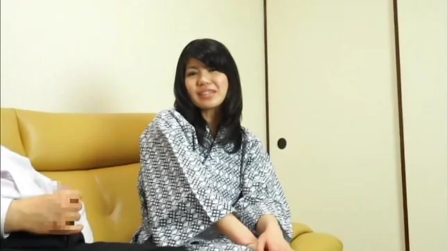 Hot Asian babe gives a nice handjob on a sofa 2