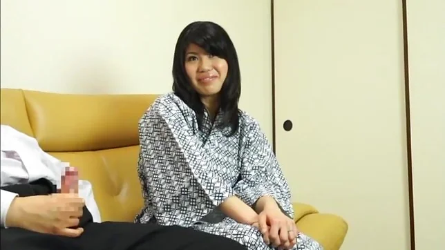 Hot Asian babe gives a nice handjob on a sofa 2