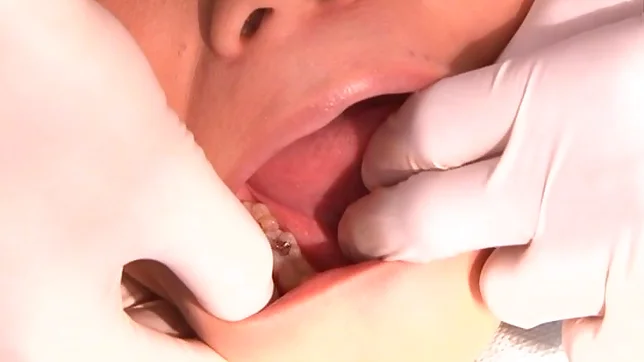 Juicy Japanese AV model is screwed by a horny dentist