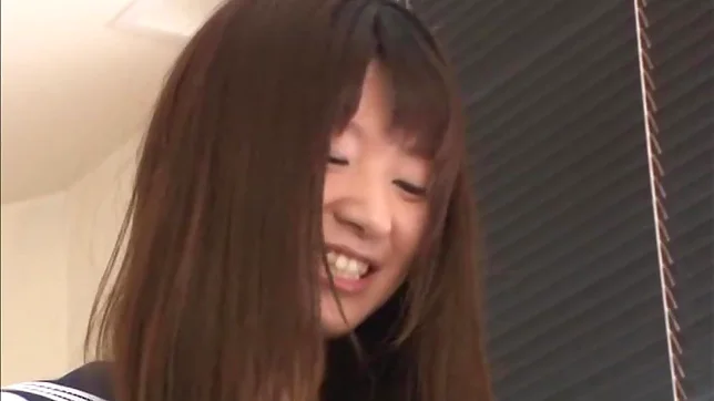 Attractive Japanese schoolgirl Rio Ogawa gives a handjob