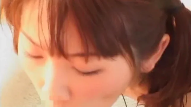 Horny young Japanese AV Model with pigtails sucks two dicks